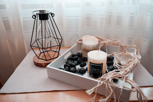 Scented Candles on White Wooden Tray