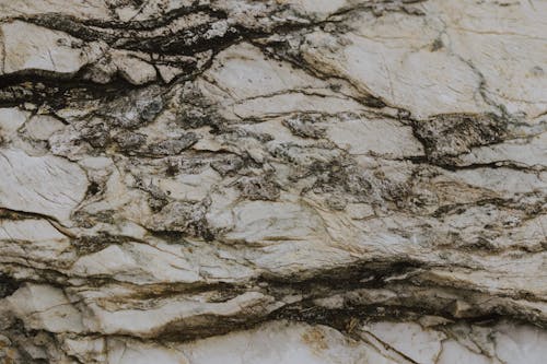 Background Texture Of Natural Rock With Cracks