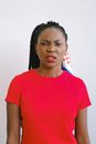 Woman in Red Shirt and Lipstick Looking Disgusted