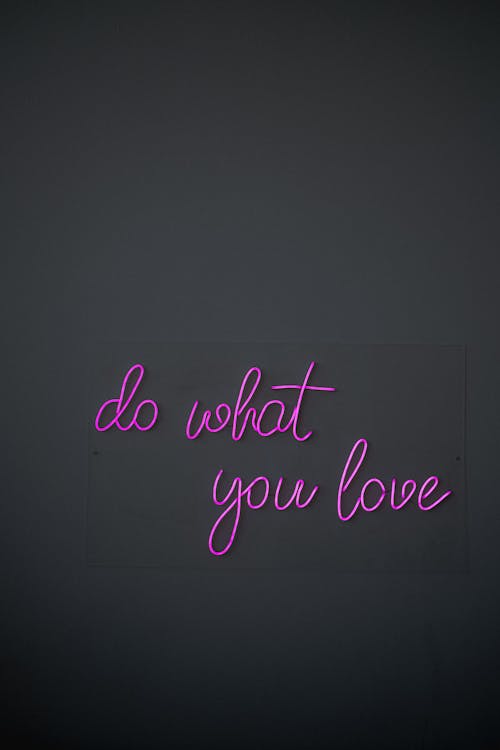 Xbox President Declares Exclusive Games 'Antiquated'-Is the Console War Over? 2 A diverse group of friends laughing and playing video games together on a couch.