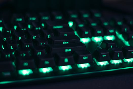 Close-up of a glowing mechanical keyboard with green LED lights perfect for gaming setups.
