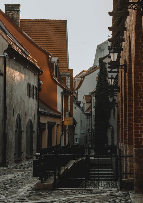 Free Old house facades and cobblestone pathway in town Stock Photo