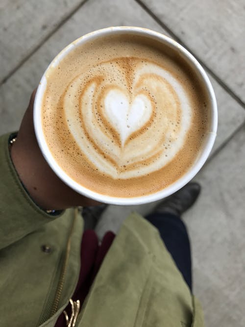 Free Person Holding Latte Cup Stock Photo
