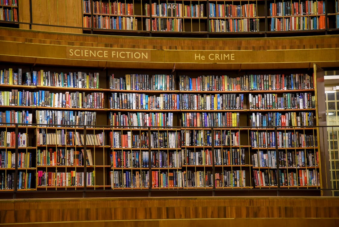 Free Public library with collection of multicolored books Stock Photo