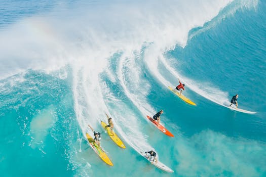 A dynamic shot of surfers riding a big wave at Waimea Bay, Hawaii. Ideal for sports and adventure themes.