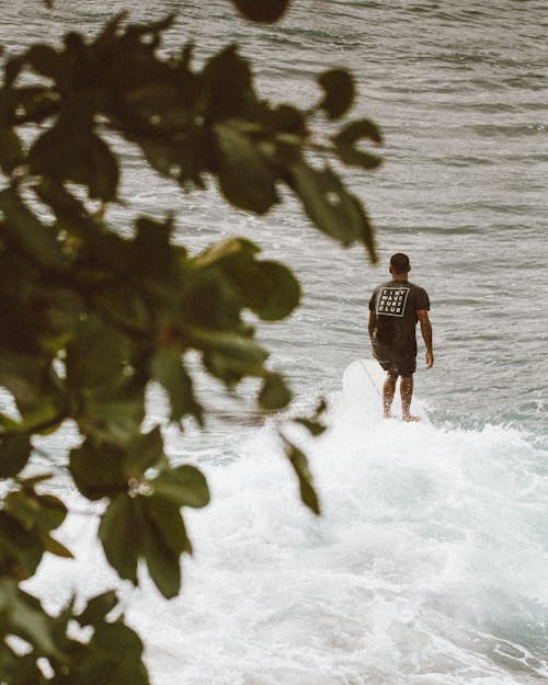 A Man Surfing on the Sea