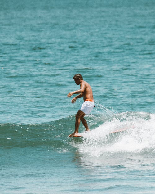 Man Using a Surfboard