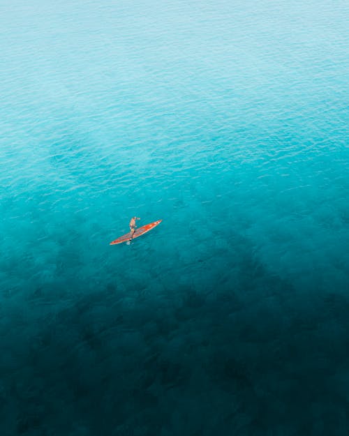 Drone Shot of a Tourists Paddle Boarding