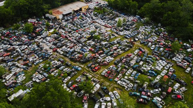 Parking for old decayed vehicles on green lawn