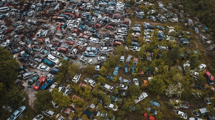 Obsolete Vehicles In Automobiles Graveyard In Industrial Area