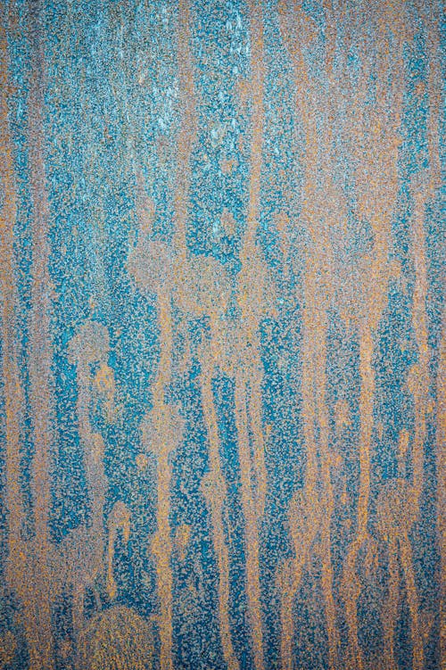Background of shabby ragged blue wall