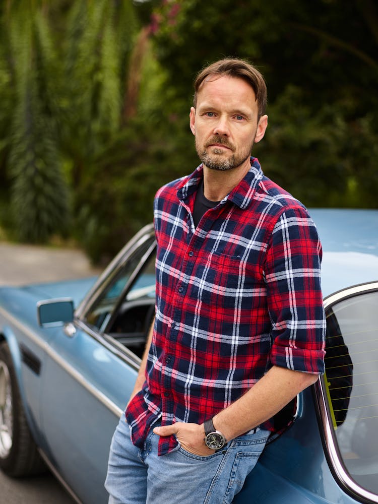 Thoughtful Man In Casual Wear Standing Near Old Auto