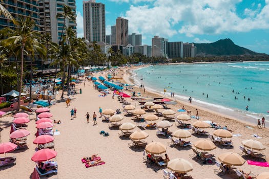 Aerial view of vibrant Waikiki Beach in Honolulu with Diamond Head in the background.