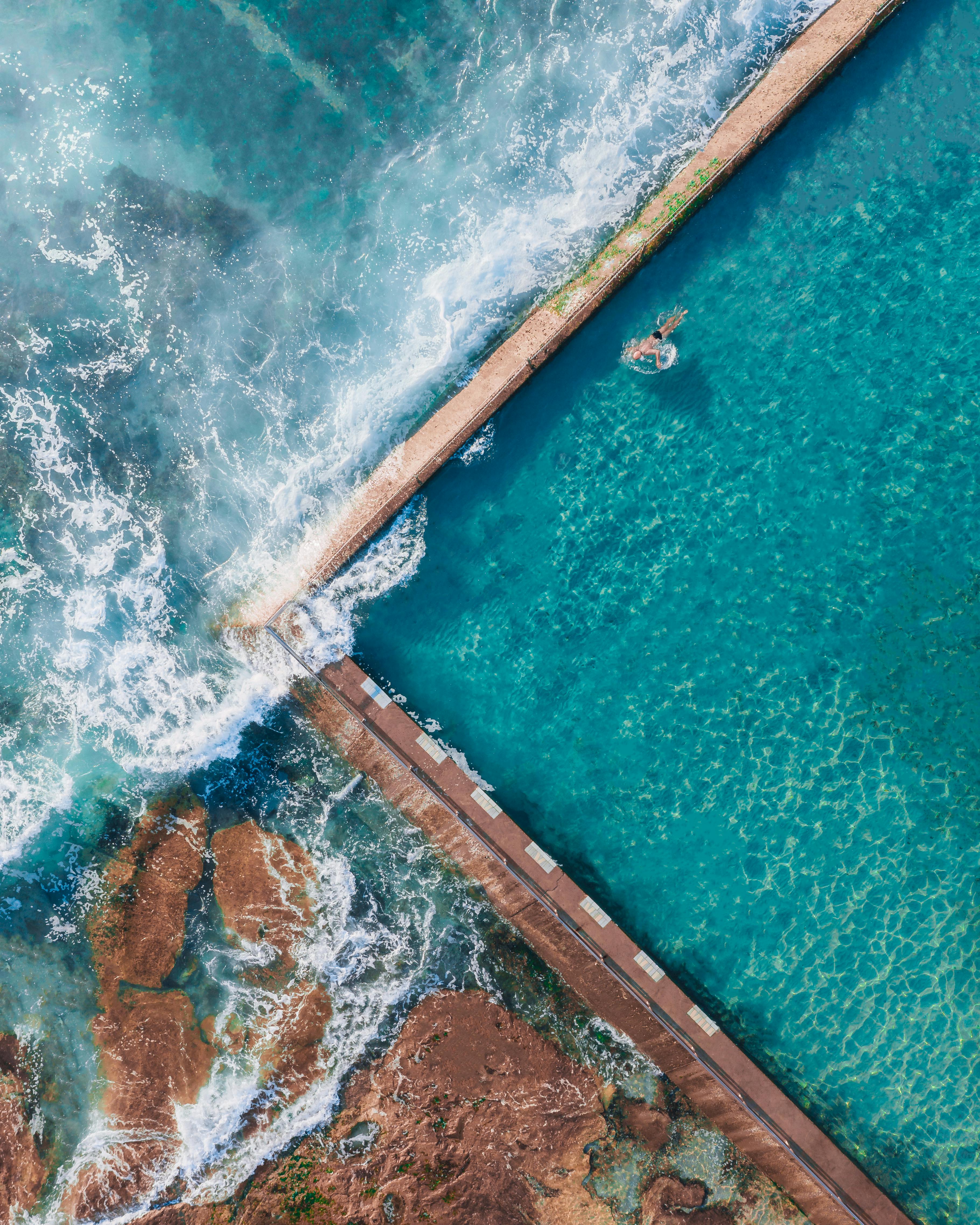 Stunning aerial view of Cronulla ocean pool in Sydney, showcasing vibrant blue waters meeting the sea.