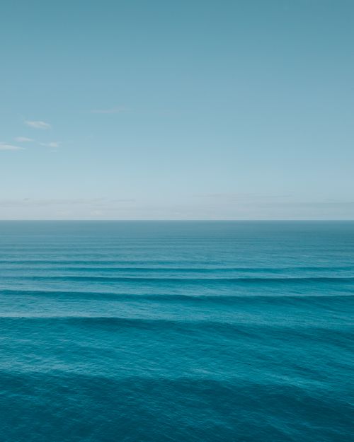 Free Serene ocean view captured in Pupukea, Hawaii, showcasing calm blue waters under a clear sky. Stock Photo