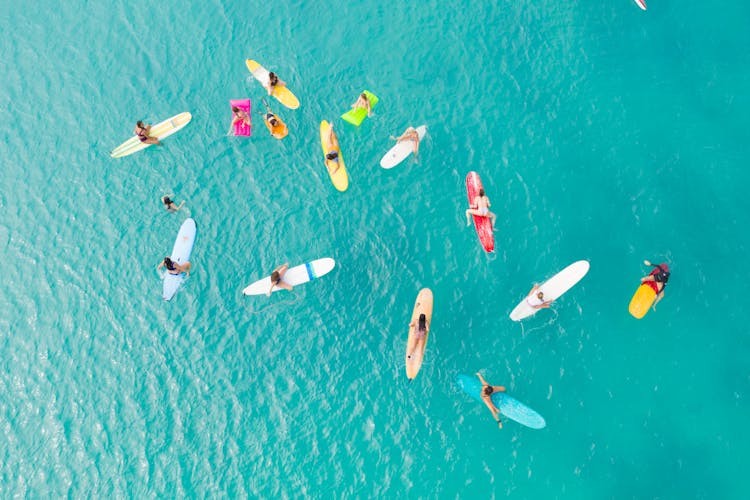 Aerial View Of Surfers On Sea