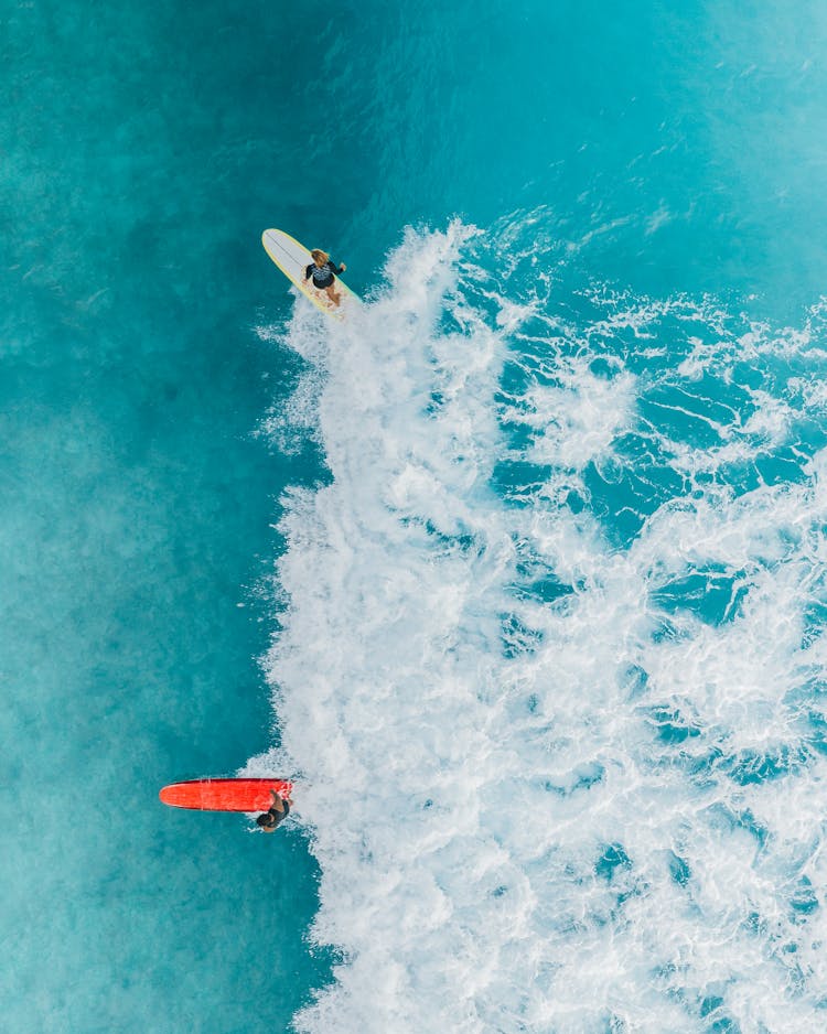 Person Surfing On Sea Waves