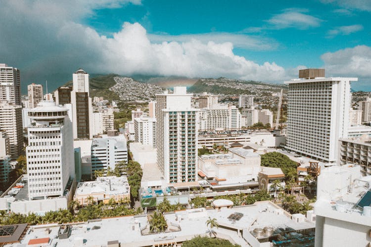 White And Gray Concrete Buildings Under Blue Sky