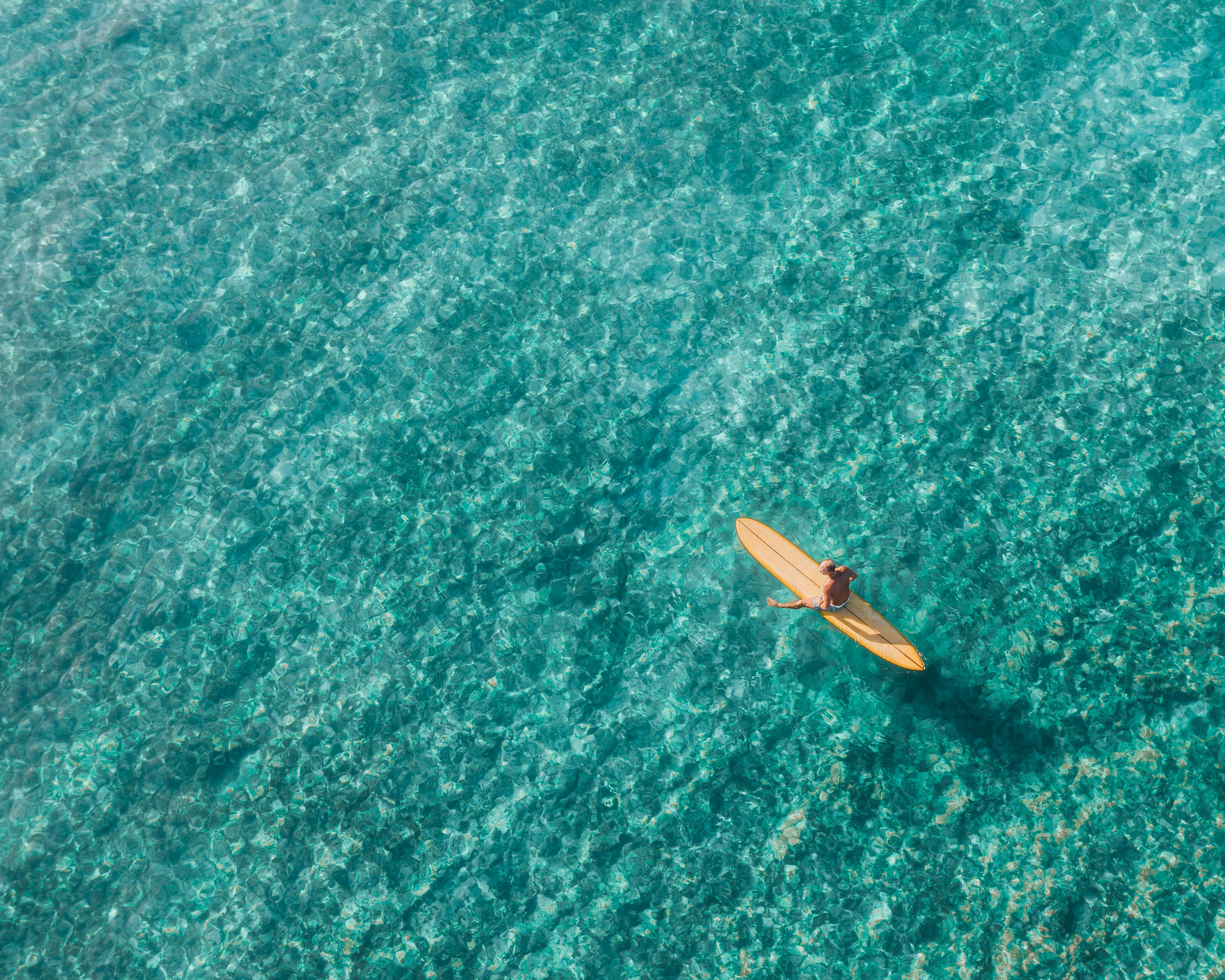 aerial view of brown boat on water