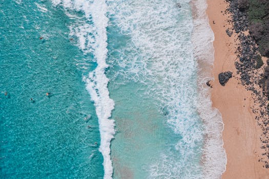 Stunning aerial view of Waimanalo Beach, HI showcasing turquoise waters and sandy shores.