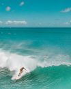 Person Surfing on Sea Waves