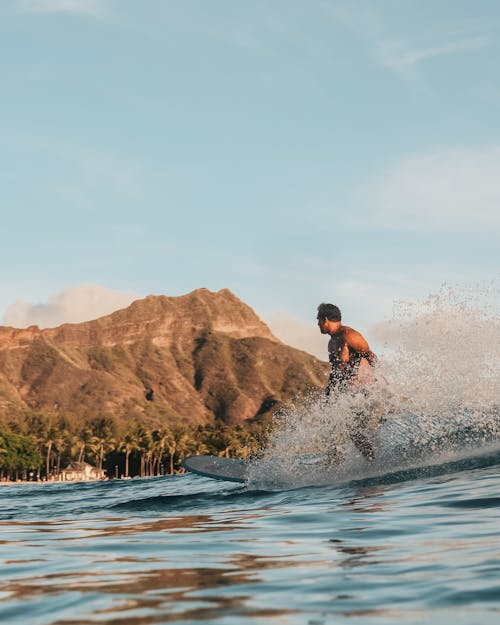 A Man Surfing on Sea Waves