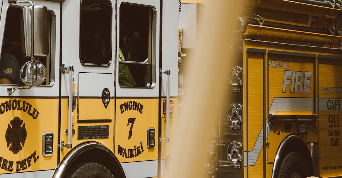 Photo by Jess Loiterton Yellow fire truck from Honolulu Fire Dept on Waikiki street, Hawaii.