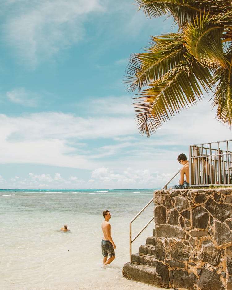 Men Hanging Out On The Beach