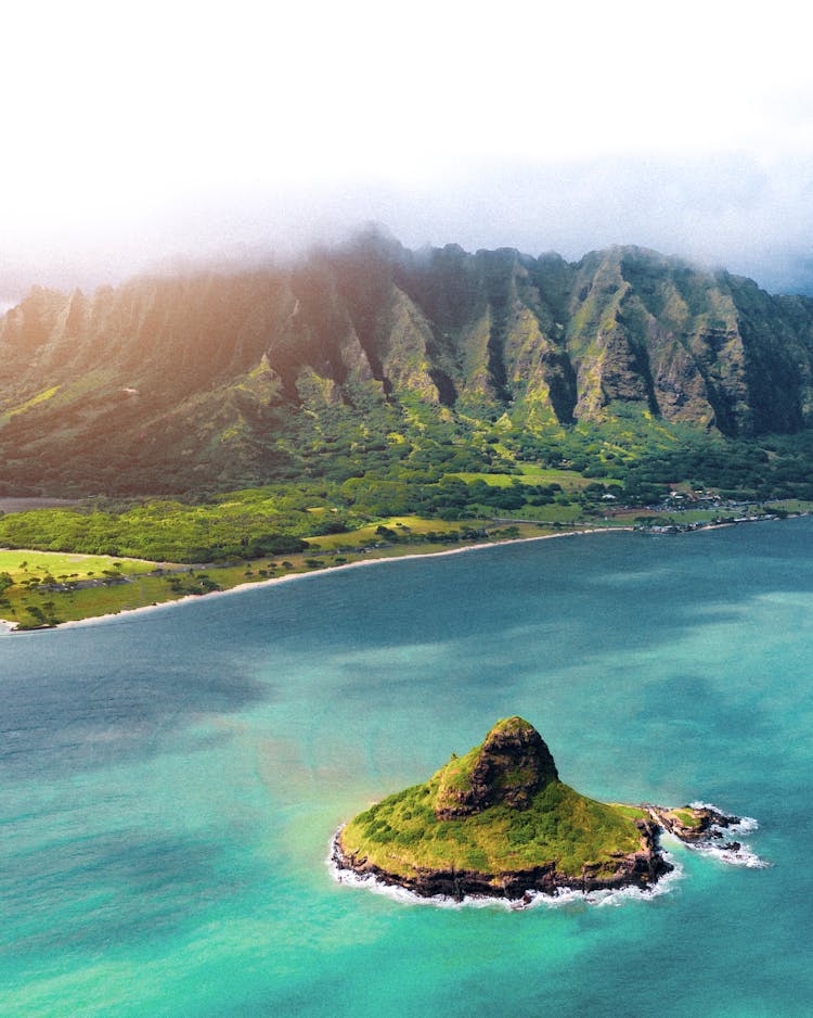 View Of Mokolii Island (Chinaman's Hat) And Koolau Mountains In Distance