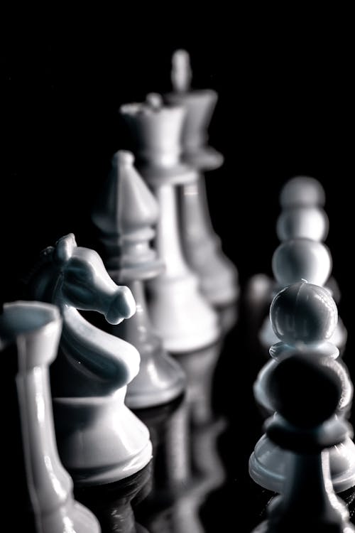 White Chess Pieces in Close Up Photography