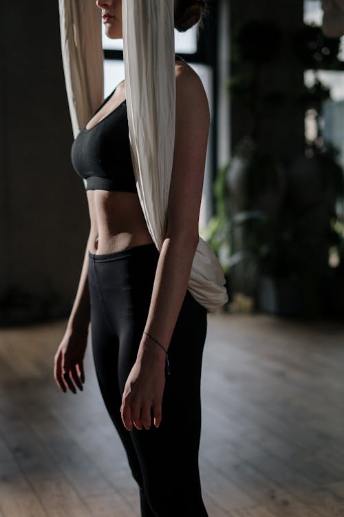 Woman in Black Sports Bra and Black Leggings