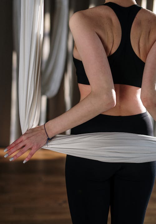 Woman in Black Sports Bra and Black Pants