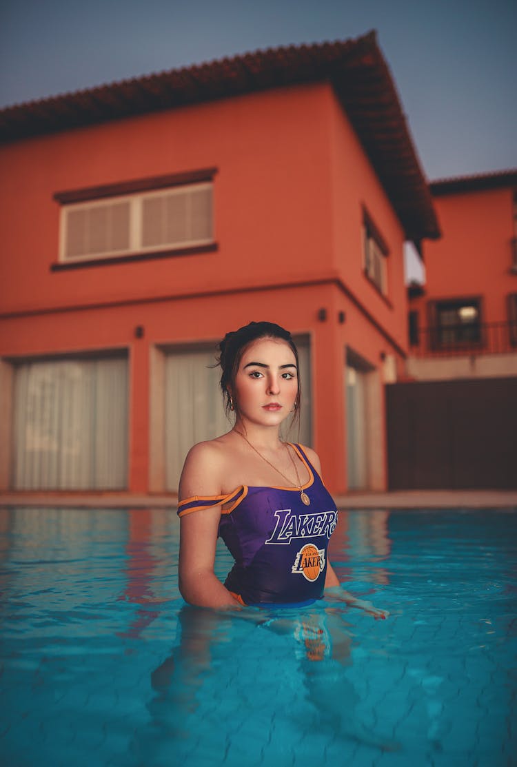 Young Brunette In House Pool