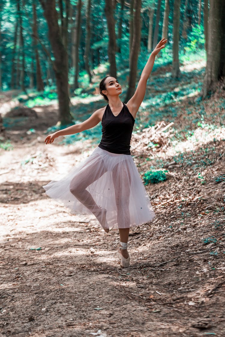A Woman Dancing Ballet In The Forest