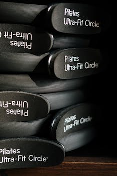 Close-up of Pilates Ultra-Fit Circles neatly stacked in a fitness center.