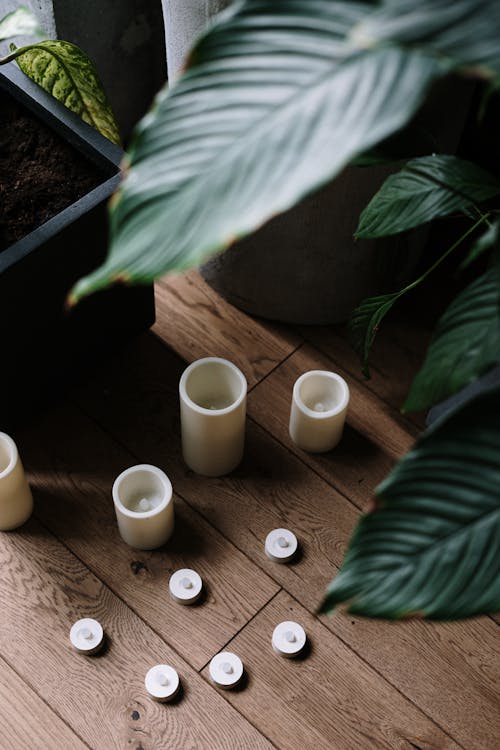 Free Four White Ceramic Mugs on Brown Wooden Table Stock Photo