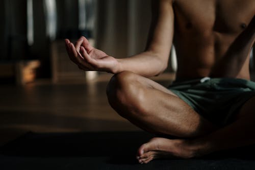 Free Man in Black Shorts Sitting on Floor Stock Photo