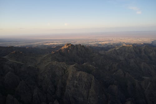 Landscape of dusky mountains with light hazy valley in distance