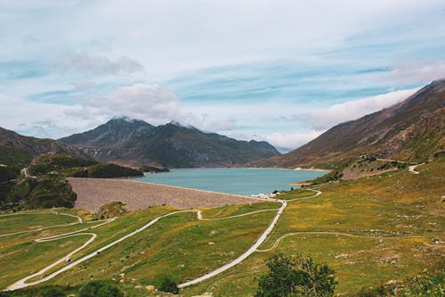 Roads in valley near lake and mountains