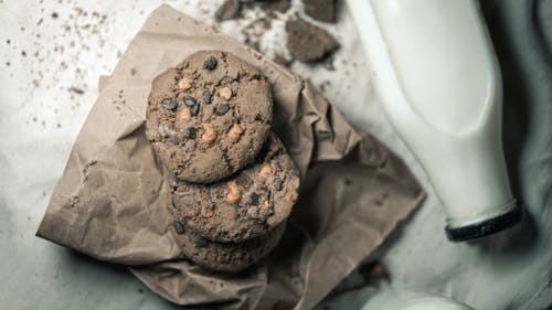 Free Overhead Shot of Chocolate Chip Cookies Beside a Glass of Milk Stock Photo