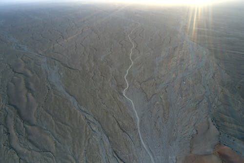 Sand desert illuminated by colorful sunbeam