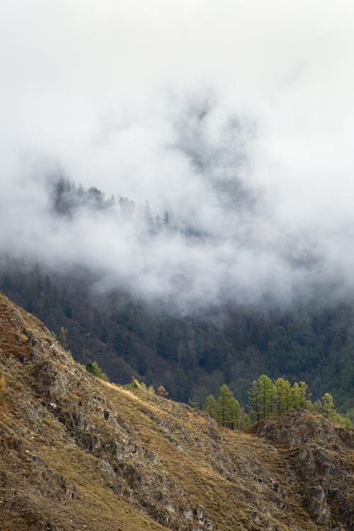 Mountain ridge in clouds in daylight