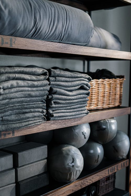 Gray Textile on Brown Wooden Shelf