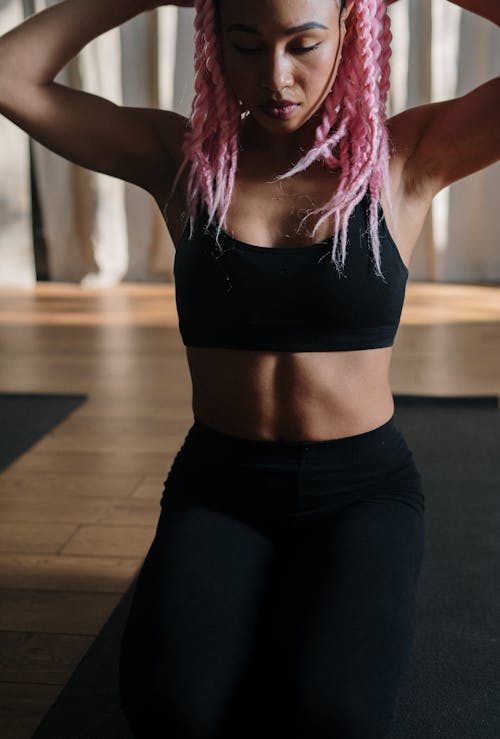 Woman in Black Sports Bra and Black Shorts