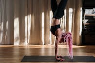 Woman in Black Sports Bra and Black Leggings Doing Yoga