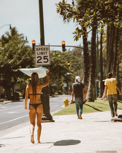 People Walking on the Sidewalk