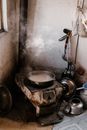 Metal pan on rusty cook in kitchen