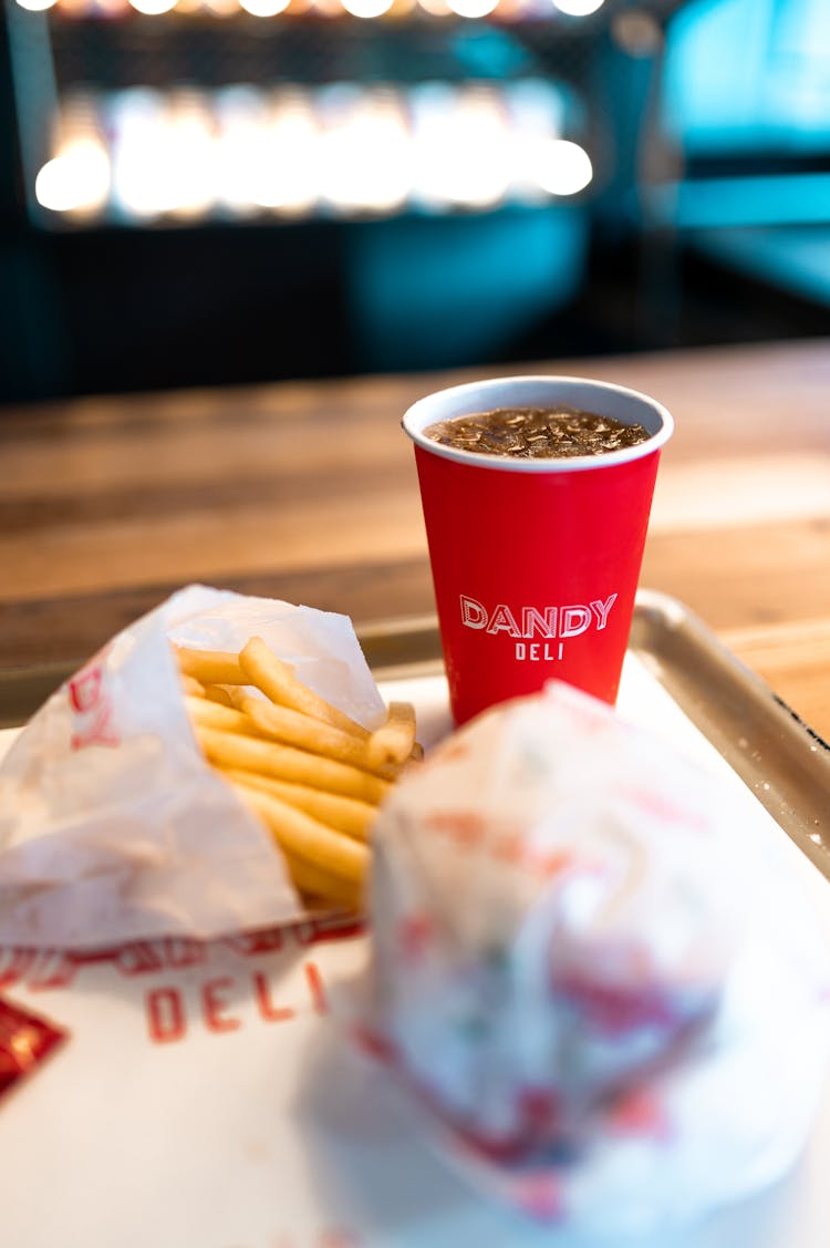 A Fries And Drink On Tray