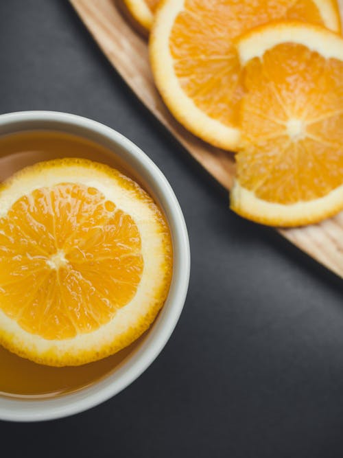 Sliced Orange in White Ceramic Mug