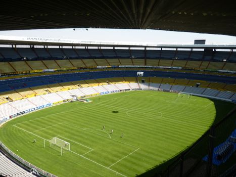 Spacious soccer stadium with green field in Jalisco del Refugio, Mexico.